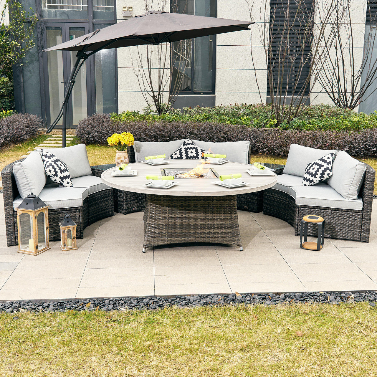A durable and stylish outdoor rattan sofa set with a firepit table.